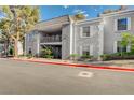 Charming two-story condo featuring a second-story balcony and manicured landscaping at 3823 S Maryland Pkwy # P1, Las Vegas, NV 89119