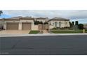 Stunning single-story home boasts a gated entrance, arched windows and a spacious three-car garage at 4208 Agosta Luna Pl, Las Vegas, NV 89135