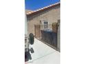 Gated side yard with trashcans at 5020 Wildroot Rd, Las Vegas, NV 89130