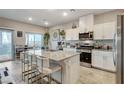 Spacious kitchen features stainless steel appliances and large granite island at 5236 Sunstone Mesa Dr, Las Vegas, NV 89166