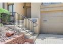 Charming walkway with stairs leading up to the front door and attached two-car garage at 532 Greenbriar Pl, Boulder City, NV 89005