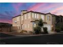 Two-story home on a corner lot featuring a two-car garage and attractive landscaping with easy access to roads at 5695 Merced St, Las Vegas, NV 89148