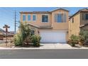 Well-maintained two-story home featuring a two-car garage, neutral color palette, and manicured landscaping at 5695 Merced St, Las Vegas, NV 89148