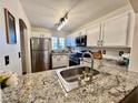 Bright kitchen with stainless steel appliances and granite countertops at 6699 Oxendale Ave, Las Vegas, NV 89139