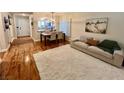 Comfortable living space with hardwood flooring and modern décor at 6699 Oxendale Ave, Las Vegas, NV 89139
