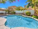 Gorgeous swimming pool and spa surrounded by lush landscaping and a relaxing gazebo at 6779 Goose Watch Ct, Las Vegas, NV 89139