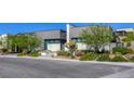 Contemporary home with desert landscaping, featuring clean lines, neutral colors, and an inviting entrance at 787 Keyland St, Las Vegas, NV 89138