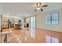 Bright kitchen area with stainless steel appliances, central island and lots of counter space at 89 Autumn Day St, Henderson, NV 89012