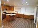 Spacious kitchen with an island and stainless steel appliances at 8982 Leaping Pad Ct, Las Vegas, NV 89148