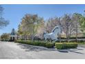 Beautiful landscaping with a horse statue welcomes you to the upscale neighborhood at 9704 Royal Lamb Dr, Las Vegas, NV 89145