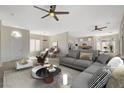 Spacious living room features a neutral color palette, plush seating, and ample natural light at 10100 Folsom Dr, Las Vegas, NV 89134