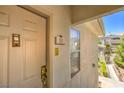 Close-up shot of a unit entrance door with a visible unit number and external architectural details at 10109 Jacob Pl # 203, Las Vegas, NV 89144
