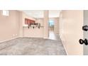 Living room featuring new gray carpeting and an open layout at 10230 Viterbo St, Las Vegas, NV 89183