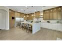 Open kitchen features a large island, built-in stainless steel appliances, and ample counter space at 10277 Roma Madre Ave, Las Vegas, NV 89135