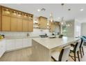 Stylish kitchen showcasing a large island, custom cabinetry, and modern finishes at 10277 Roma Madre Ave, Las Vegas, NV 89135