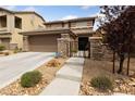 Charming two-story home boasts a well-kept front yard, gated entry, desert landscaping and a two car garage at 10440 Bay Ginger Ln, Las Vegas, NV 89135