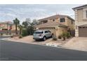 A well-maintained two-story home featuring a tile roof and manicured landscaping at 10948 Carberry Hill St, Las Vegas, NV 89141