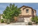 Charming two-story home featuring a well-maintained front yard and attached two-car garage at 11177 Deluna St, Las Vegas, NV 89141