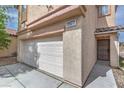 Attached two-car garage featuring new white door at 11177 Deluna St, Las Vegas, NV 89141