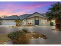 Charming single-story home featuring desert landscaping and an inviting curb appeal on a sunny day at 1251 Cavalry St, Pahrump, NV 89048