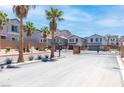 Auburn Ridge street view showing entrance, palm trees, houses and mountain views at 1323 Cerulean Ave, Henderson, NV 89002