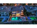 An aerial view of backyard featuring a sparkling pool with lounge area at 1972 Alcova Ridge Dr, Las Vegas, NV 89135