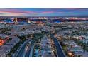 An aerial view of a community with the city skyline in the distance at 1972 Alcova Ridge Dr, Las Vegas, NV 89135