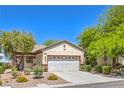 Well-kept home with desert landscaping, a two-car garage and stylish architectural details at 2550 Evening Twilight Ave, Henderson, NV 89044