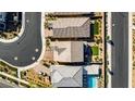 Aerial shot of a community showing houses with well-manicured lawns and neatly arranged streetscapes at 2628 Ferrara St, Henderson, NV 89044