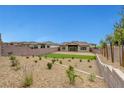 Expansive backyard featuring low-maintenance landscaping and views of surrounding homes at 281 Gandara St, Las Vegas, NV 89138