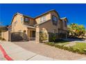 Inviting two-story home with desert landscaping and a gated courtyard entry at 29 Blue Valley Dr, Henderson, NV 89002
