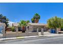 Single-story home with gated entry, desert landscaping, and mature shade trees at 4533 Diamond Head Dr, Las Vegas, NV 89110