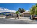 Modest single-story home with gated access and desert landscaping at 4533 Diamond Head Dr, Las Vegas, NV 89110