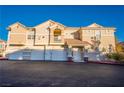 A well-maintained two-story home features a red-tiled roof and multiple garage spaces at 5855 Valley Dr # 2161, North Las Vegas, NV 89031