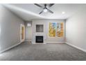 Spacious living room features recessed lighting, a ceiling fan, and a decorative fireplace at 5855 Valley Dr # 2161, North Las Vegas, NV 89031