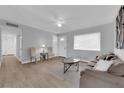 Inviting living space with neutral walls, wood-look floors, and comfortable seating at 721 Carpenter Dr, Las Vegas, NV 89107