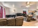 Comfortable living room featuring recliner seating and tile flooring throughout at 821 Tollbrook Way, Henderson, NV 89011