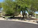 Scenic community park boasts lush green lawns, mature shade trees, and inviting walking paths at 8237 Cline Mountain St, Las Vegas, NV 89131