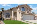 Home featuring a manicured lawn and walkway leading to the front door at 8714 Las Posas Ave, Las Vegas, NV 89147