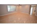Spacious living area with hardwood floors, plantation shutters and recessed lighting at 9408 Amber Valley Ln, Las Vegas, NV 89134