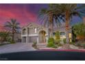 Beautiful two-story home features a landscaped yard and a stylish paver driveway at 11158 Antonine Wall Ct, Las Vegas, NV 89141