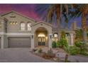 Charming home featuring manicured landscaping and an inviting arched entryway at 11158 Antonine Wall Ct, Las Vegas, NV 89141
