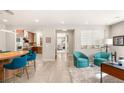 Bright and airy living room featuring stylish furniture and views into the modern kitchen at 11398 Belmont Lake Dr # 104, Las Vegas, NV 89135