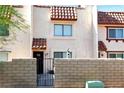 Charming townhome entrance featuring secure gated front yard and desert landscaping at 1312 Rawhide St, Las Vegas, NV 89119