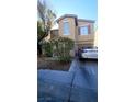 Charming two-story home with desert landscaping, a driveway, and an attached garage at 2131 Pillar Pointe St, Las Vegas, NV 89115