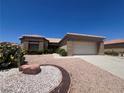 Charming single-story home with xeriscaped front yard and an attached two-car garage at 2501 Maddington Dr, Las Vegas, NV 89134