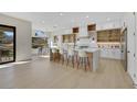 Open concept kitchen with a large island, seating for five, and views of the breakfast nook at 2621 Spalding Dr, Las Vegas, NV 89134