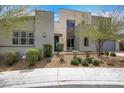 Modern home featuring a desert-style yard with low-maintenance landscaping and a two-car garage at 3005 Merlesco Ave, Henderson, NV 89044