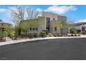 Contemporary home with desert landscaping, including mature trees and shrubbery around the front yard at 3005 Merlesco Ave, Henderson, NV 89044