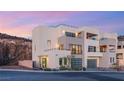 Stylish multi-level home featuring balconies, a two-car garage, and clean, modern lines at 350 Solitude Peak Ln, Henderson, NV 89012